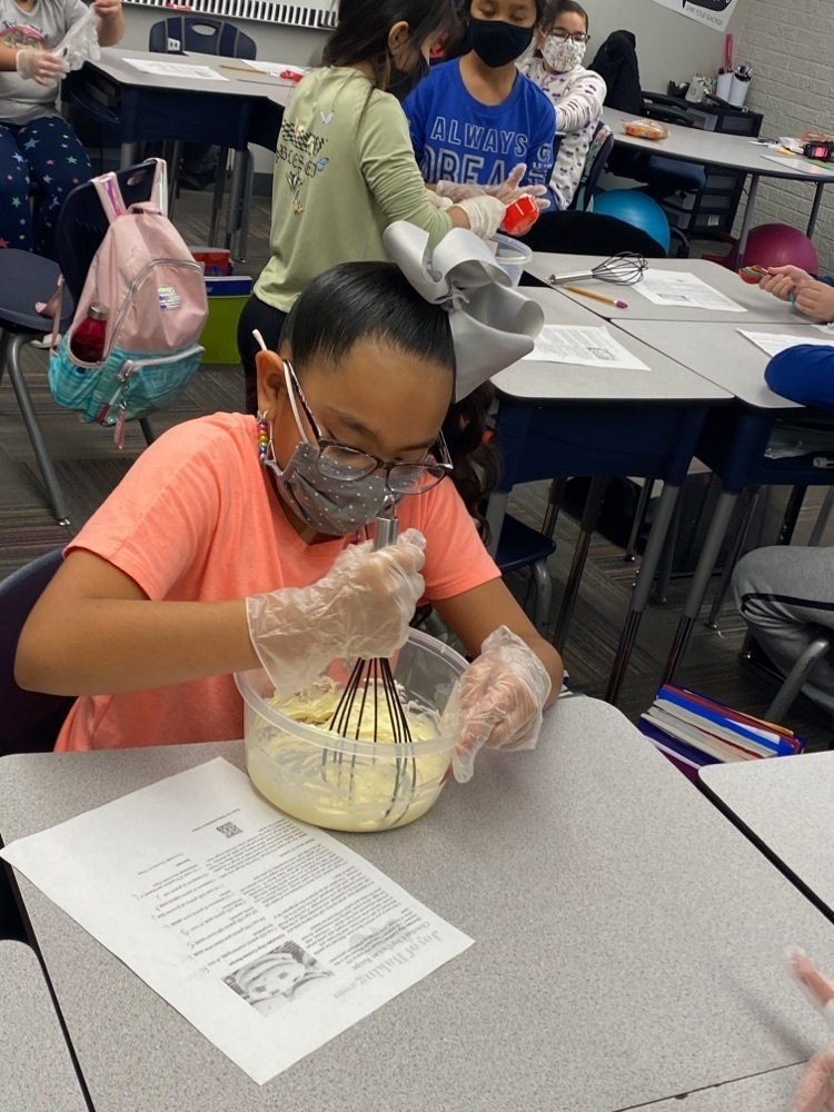 student baking cookies using fractions