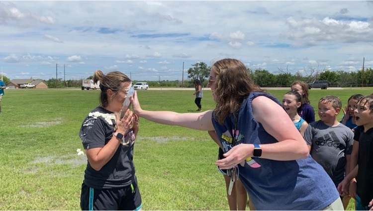 Mrs Lewis pies Mrs cade in the face
