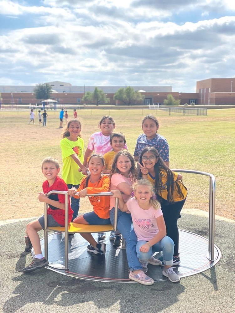 sis students on merry go round