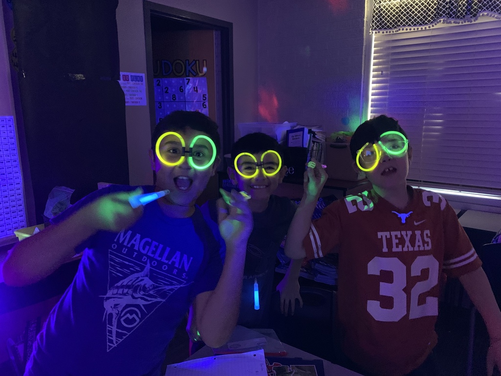 students pose for pictures on "Glow Day" Mrs. Sorrells' creative test prep