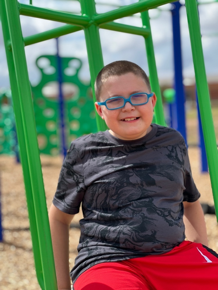 boy smiling on playground 