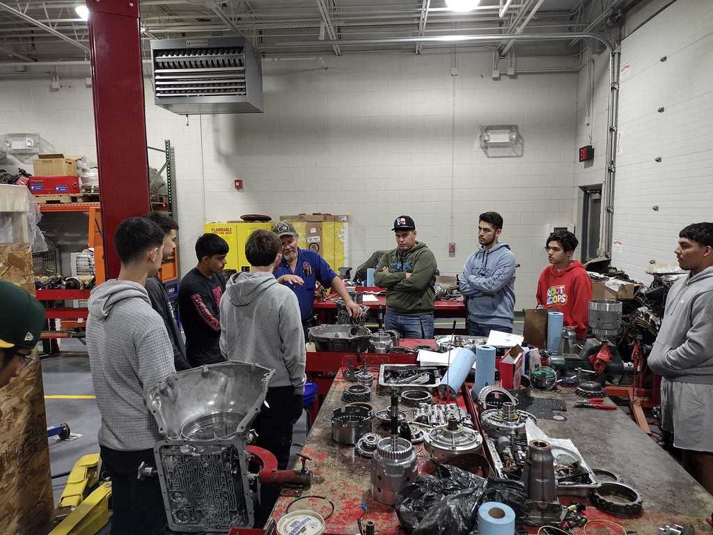 photo of students at SPC 's auto body shop