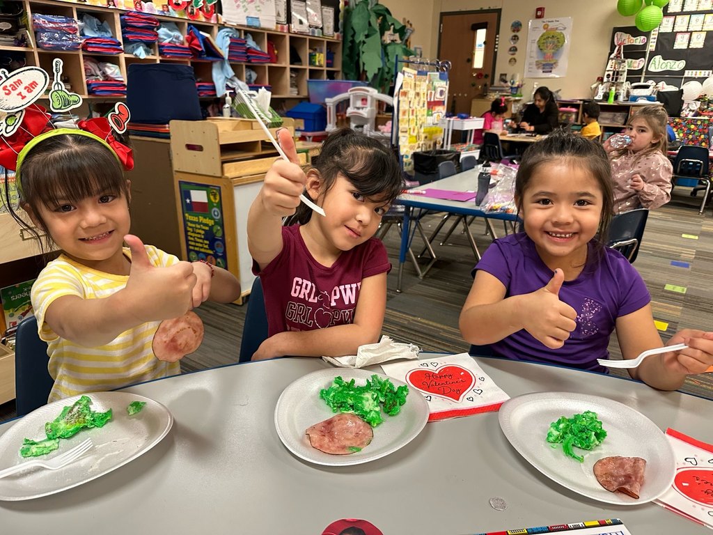students cooking and eating green eggs and ham