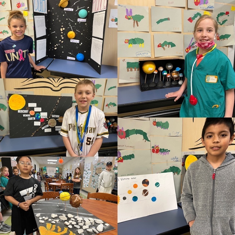 students posing with solar system projects