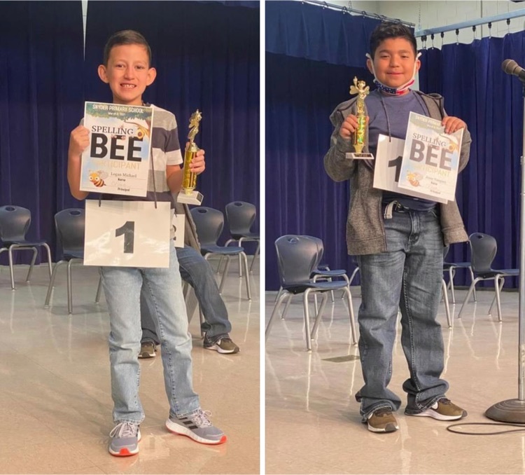 photo of spelling bee winners holding trophy